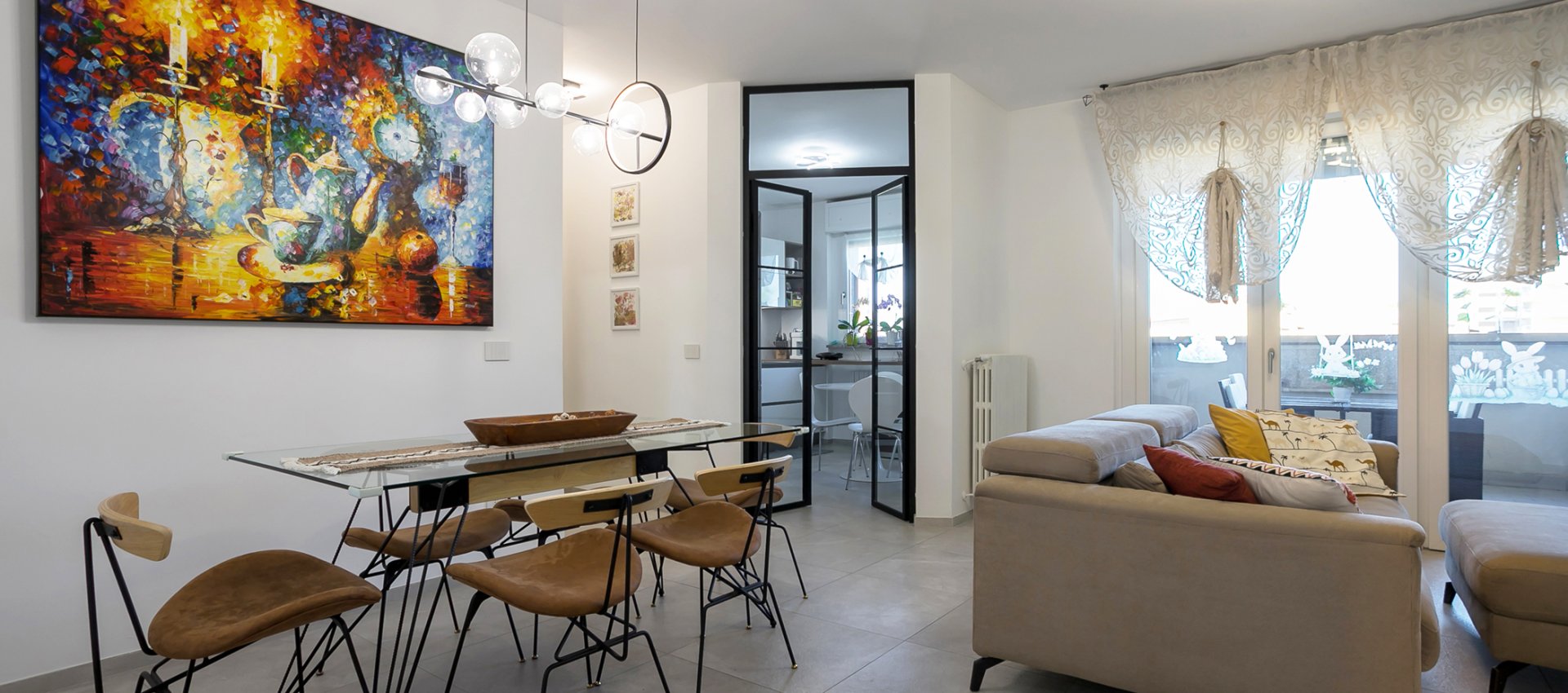 Trilocale ristrutturato con terrazzi, box e cantina